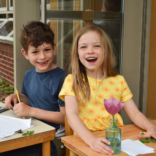 Students working on a creative project outdoors